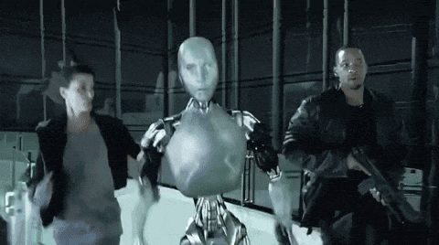 a man holding a gun stands next to a robot and a woman