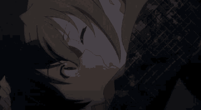 a man and a woman kissing in a dark room .