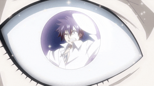 a close up of a person 's eye with a cartoon character inside of it