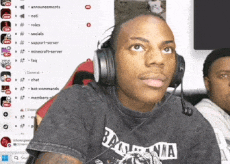 a man wearing headphones and a black shirt that says bama