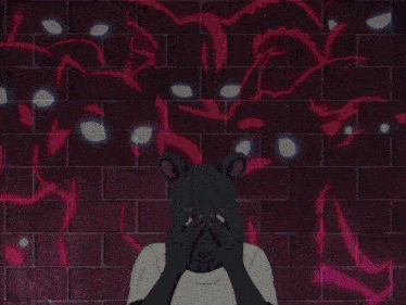 a person wearing a black mask stands in front of a group of animals