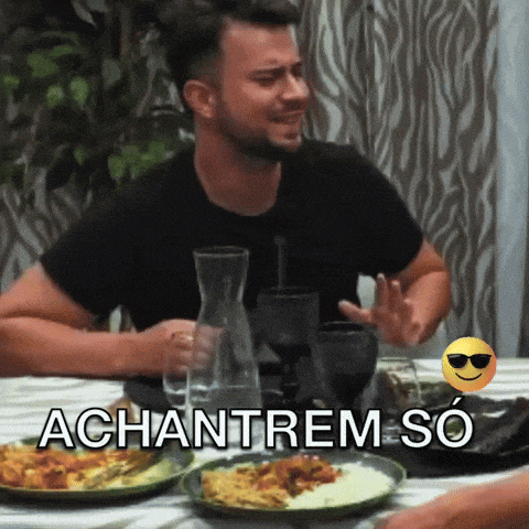 a man is sitting at a table with plates of food and the words " achanrem so " below him