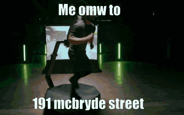 a man wearing a virtual reality headset is dancing in front of a screen that says me omw to 191 mcbryde street