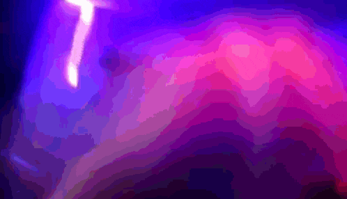 a purple and pink background with a white light