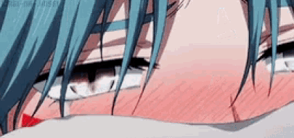 a close up of a person 's face with blue hair and red cheeks
