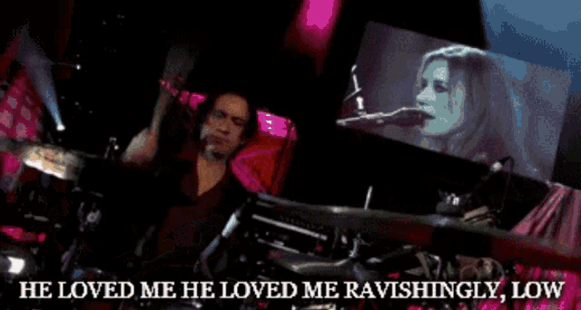 a woman singing into a microphone with the words " he loved me he loved me ravishingly low " below her