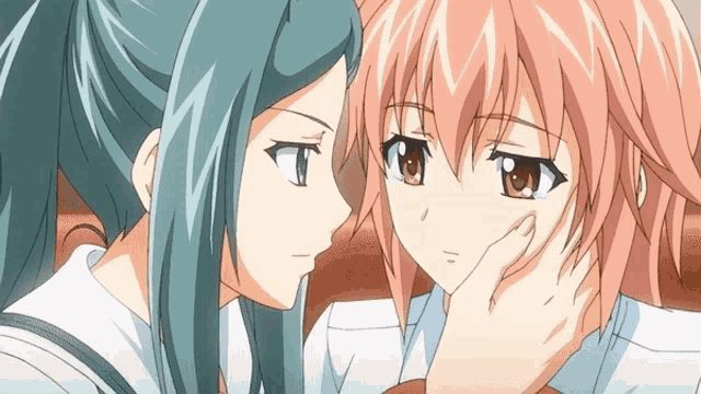 two anime girls are looking at each other and one is touching the other 's face