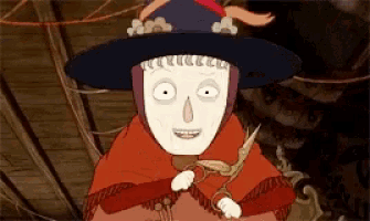 a cartoon character wearing a black hat and a red cloak