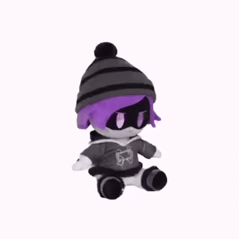 a stuffed animal with purple hair and a hat is sitting on a white surface .