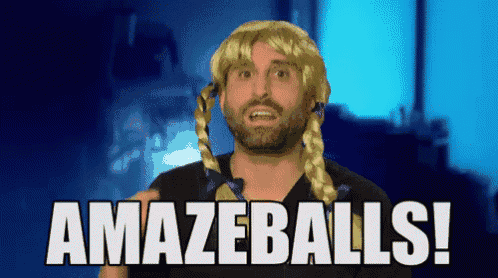 a man wearing a blonde wig says amazeballs !