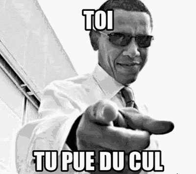 a black and white photo of barack obama pointing at the camera .