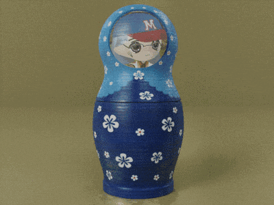 a blue doll with the letter m on it sits next to two other dolls