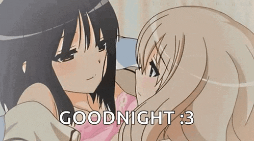 a couple of anime girls are kissing each other and the words `` goodnight '' are written on the bottom .