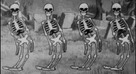 a group of skeletons are standing in a cemetery in a black and white cartoon .