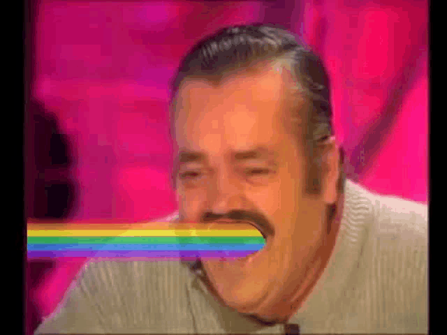 a man with a mustache is laughing with a rainbow laser coming out of his mouth .