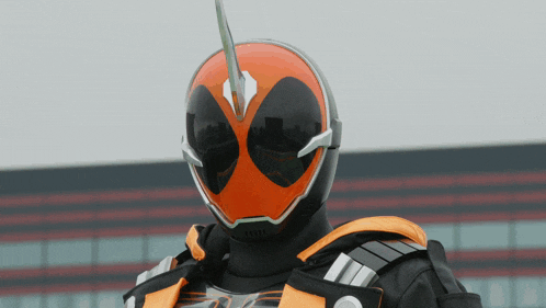 a close up of a person wearing a helmet with a horn on it
