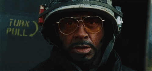 a man wearing a helmet and glasses says " survive "