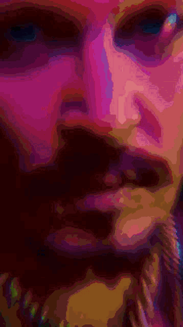 a close up of a person 's face with a purple and pink background