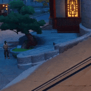 a video game character is laying on the ground in front of a building