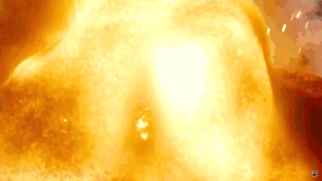 a large explosion is being displayed on a screen that says ' netflix ' on it