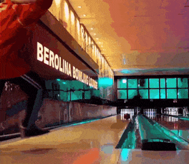 a bowling alley with the word berolina on the wall