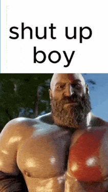 a man with a beard is standing in front of a sign that says shut up boy .