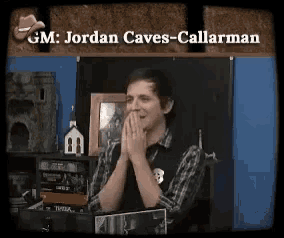 gm jordan caves-callarman is laughing while sitting at a table
