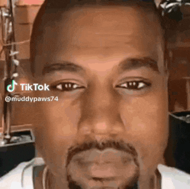 a close up of a man 's face with a beard and a tiktok watermark .