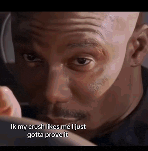 a close up of a man 's face with the caption ik my crush likes me i just gotta prove it