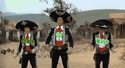 three men in mariachi costumes are dancing in the desert with the words de mayo and chico written on them .