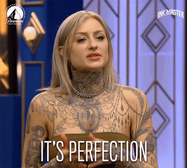 a woman with a lot of tattoos says it 's perfection on a screen
