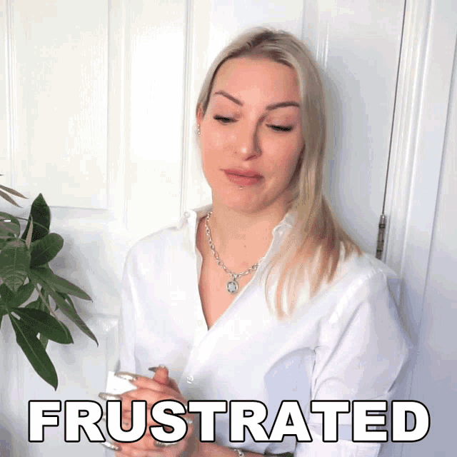 a woman in a white shirt has the word frustrated written on her face