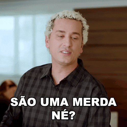 a man in a plaid shirt is asking " sao uma merda ne "
