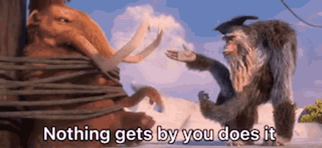 a cartoon monkey is standing next to a mammoth tied up with rope .