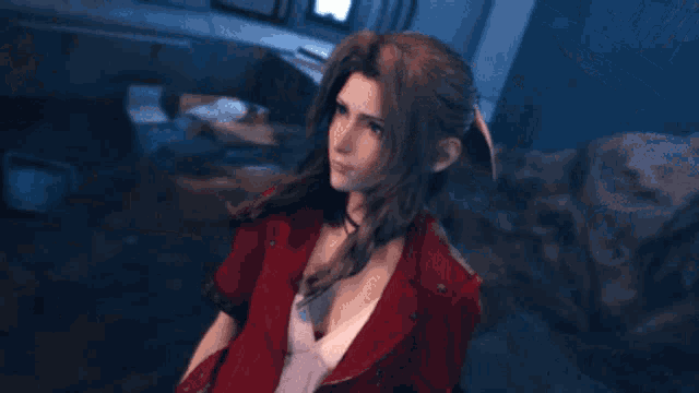a woman in a white dress and red jacket is standing on a rock
