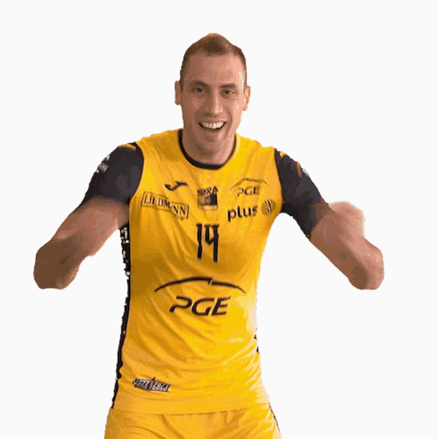 a man is wearing a yellow pge jersey with the number 14 on it