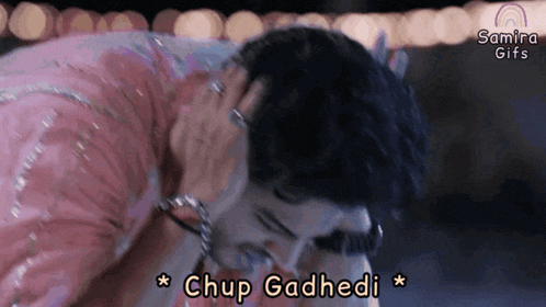 a gif of a man kissing a woman with the words chup gadhedi below him