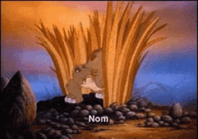 a cartoon of a rabbit with the word nom on the bottom right
