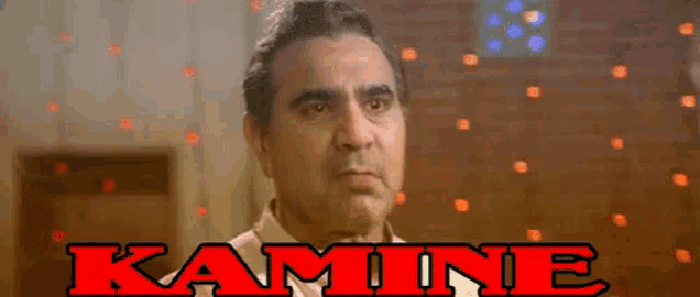 a close up of a man 's face with the word kamine on the bottom .