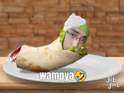 a burrito with a man 's face on it and the word wampya on the plate