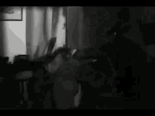 it is a black and white photo of a person 's face .