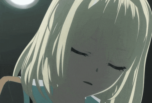 a blonde anime girl with her eyes closed looks down