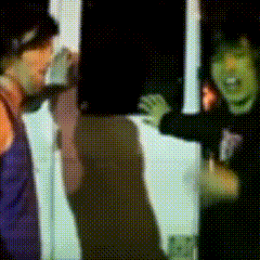 a blurry picture of a man and a woman talking