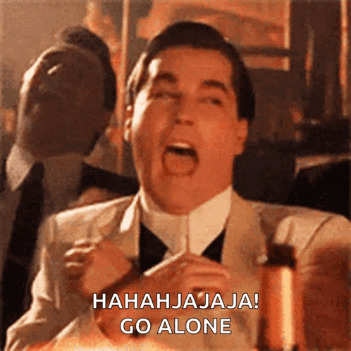 a man in a suit and tie is laughing and saying " hahhajaja go alone "