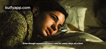 a woman is laying on a bed with a quote that says even though sometimes she is sad for many days at a time