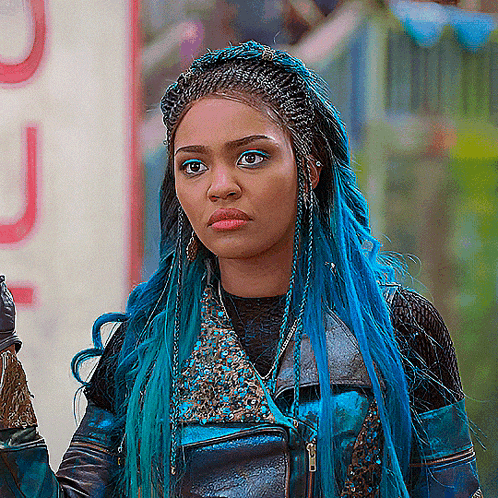 a woman with blue hair is wearing a black jacket