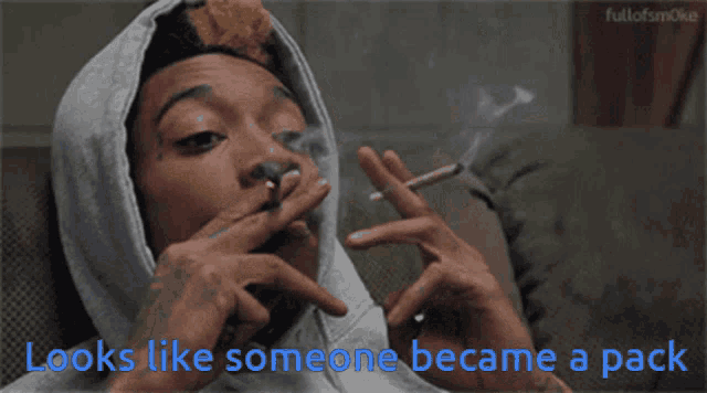 a man smoking a cigarette with the words looks like someone became a pack