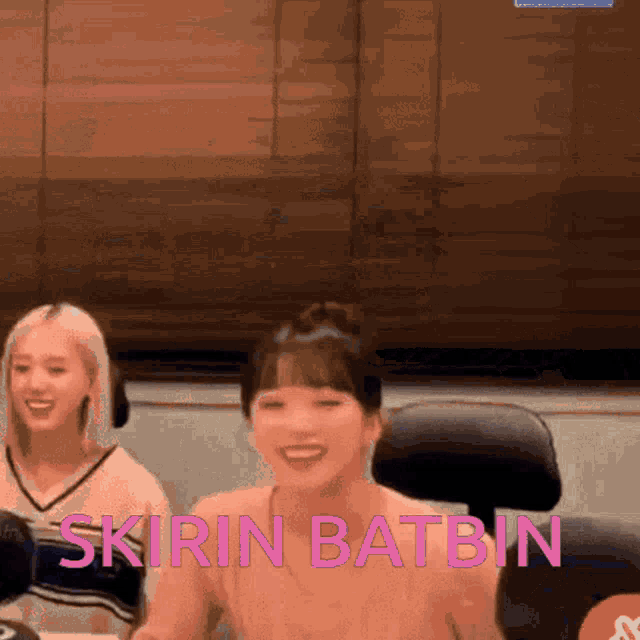 two women are sitting at a table with the words skirin batbin written on the bottom