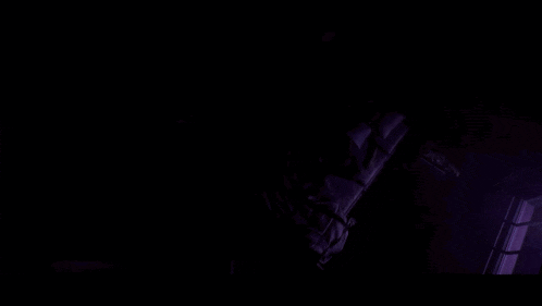 a close up of a woman 's eyes with a dark background