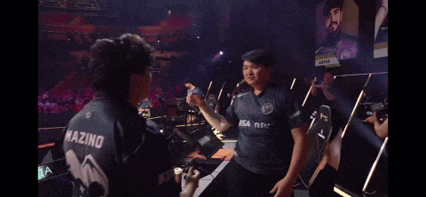 two men hugging each other with one wearing a shirt that says mazing